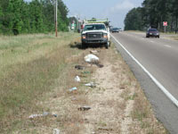 Road Rake removes debris from highway shoulder