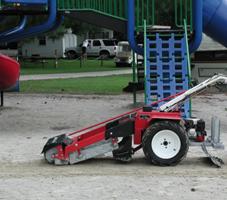 Sand Man cleaning playground sand